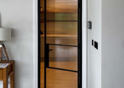 Fluted Glass Pantry Door – Bespoke Black Steel Design