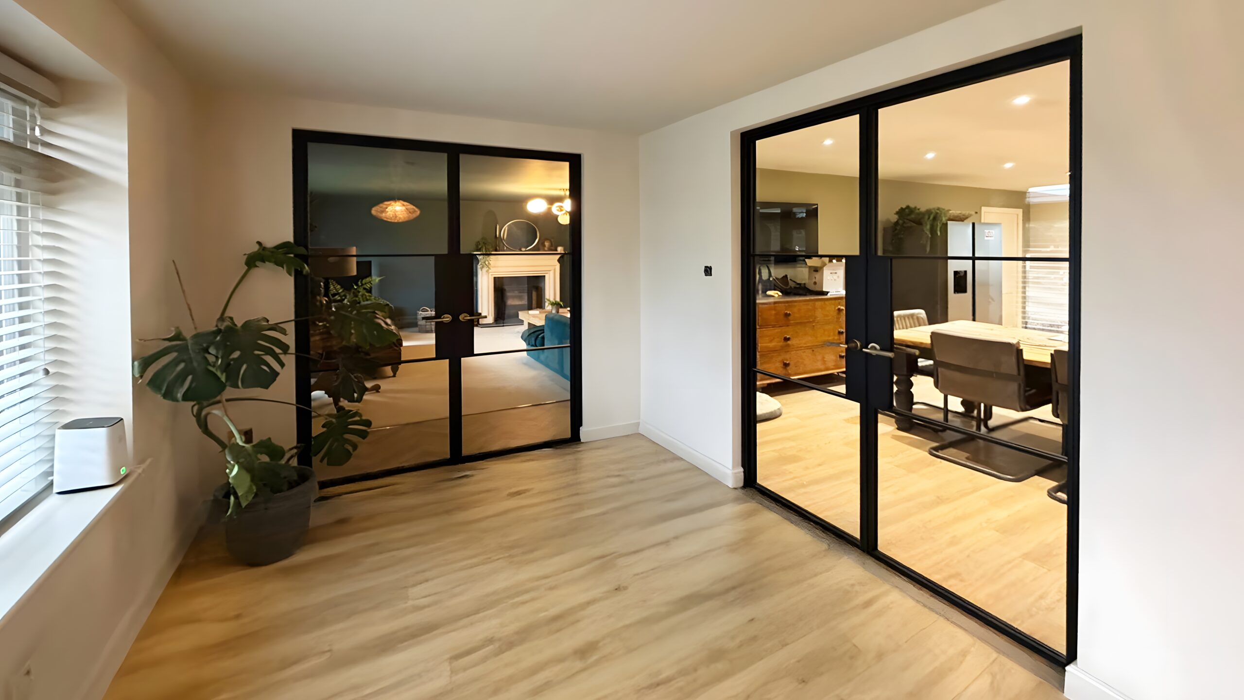 steel-glass-doors Modern living and dining room with steel glass doors